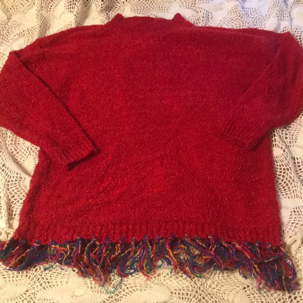 Woman’s high neck sweater.